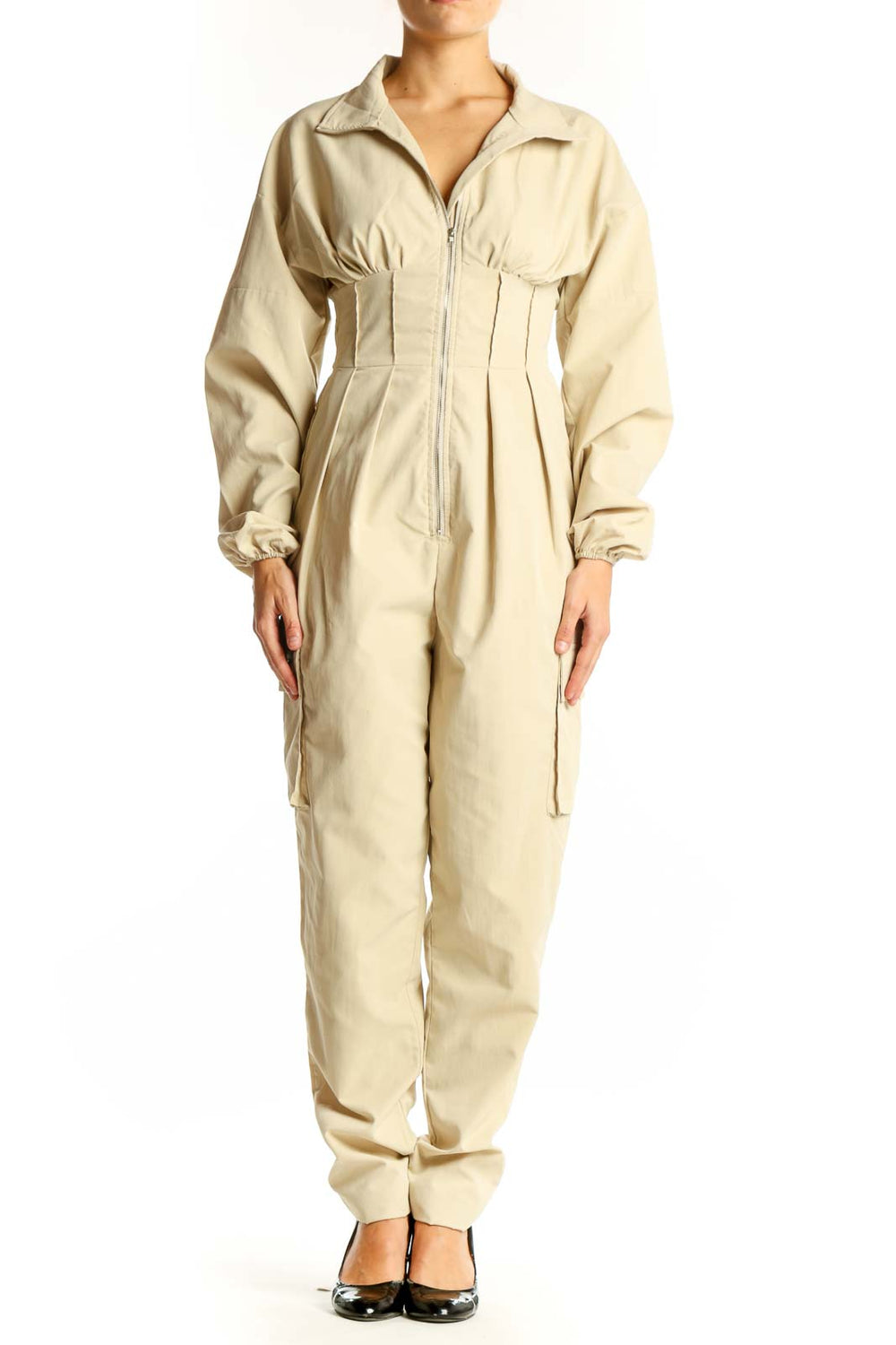 Front view of beige utility jumpsuit with zip-up front and cinched waist