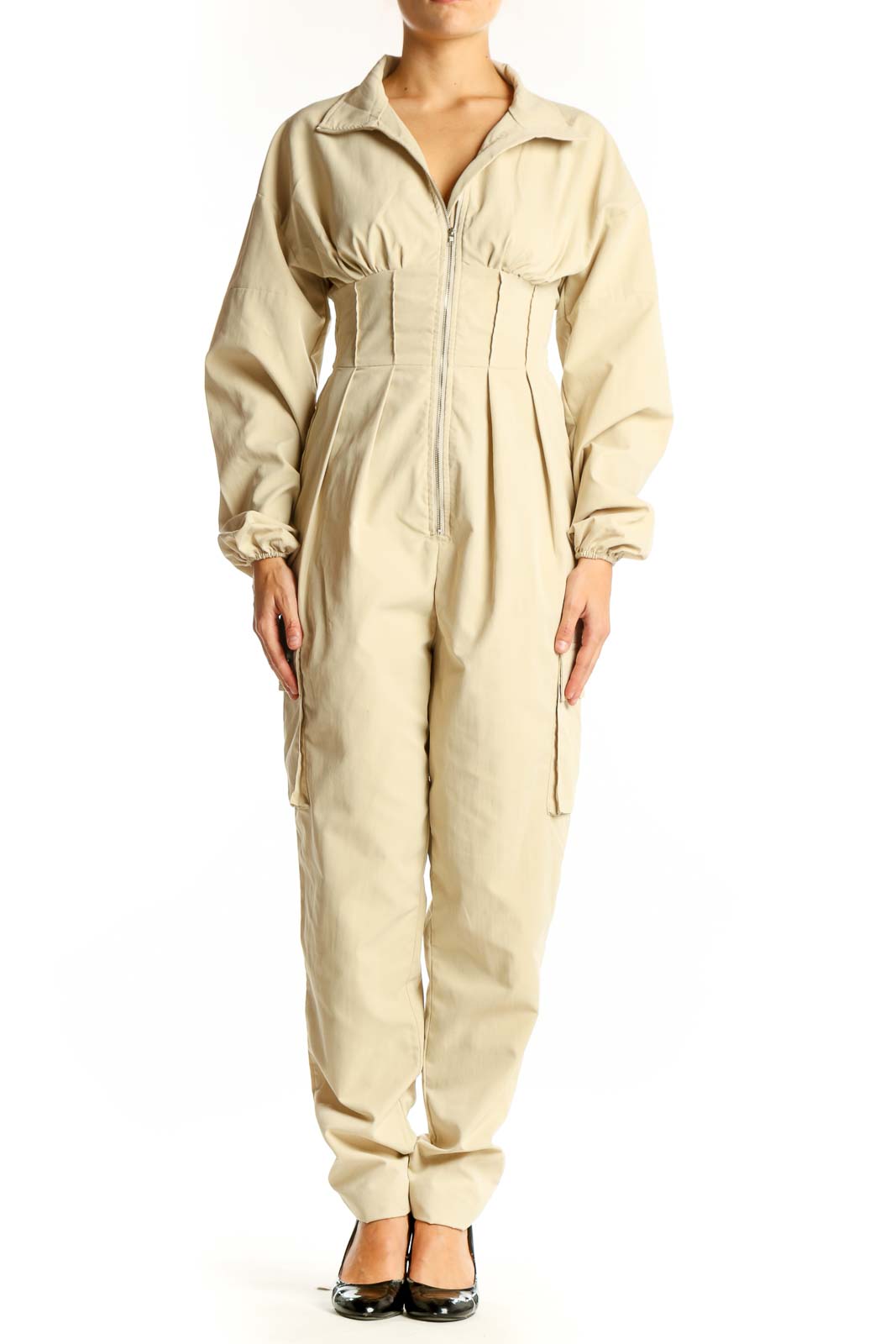Front view of beige utility jumpsuit with zip-up front and cinched waist