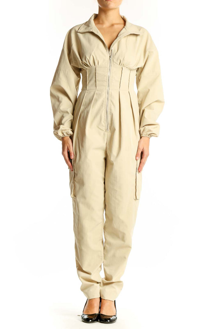 Front view of beige utility jumpsuit with zip-up front and cinched waist