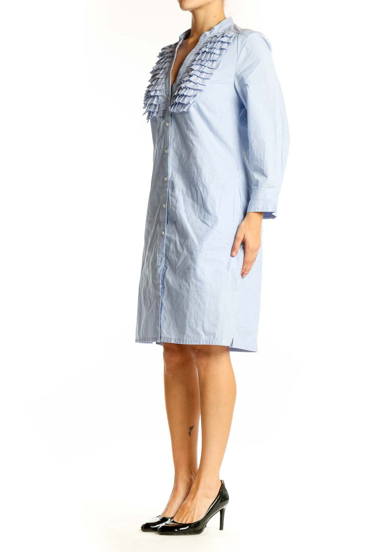 Front view of light blue Trulli cotton shirt dress with ruffled chest detail
