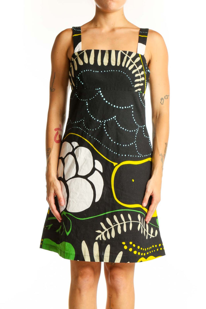 Front view of black floral print cotton sundress by Marimekko for Anthropologie