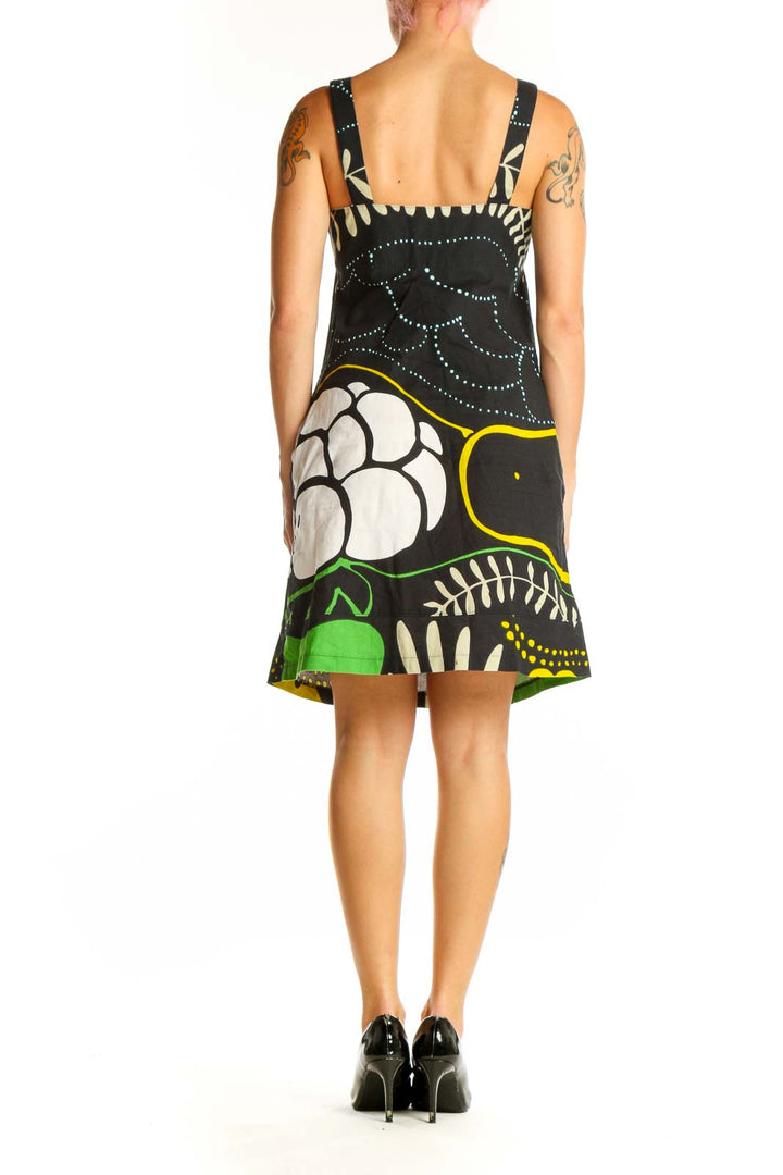 Side view of black floral print cotton sundress by Marimekko for Anthropologie