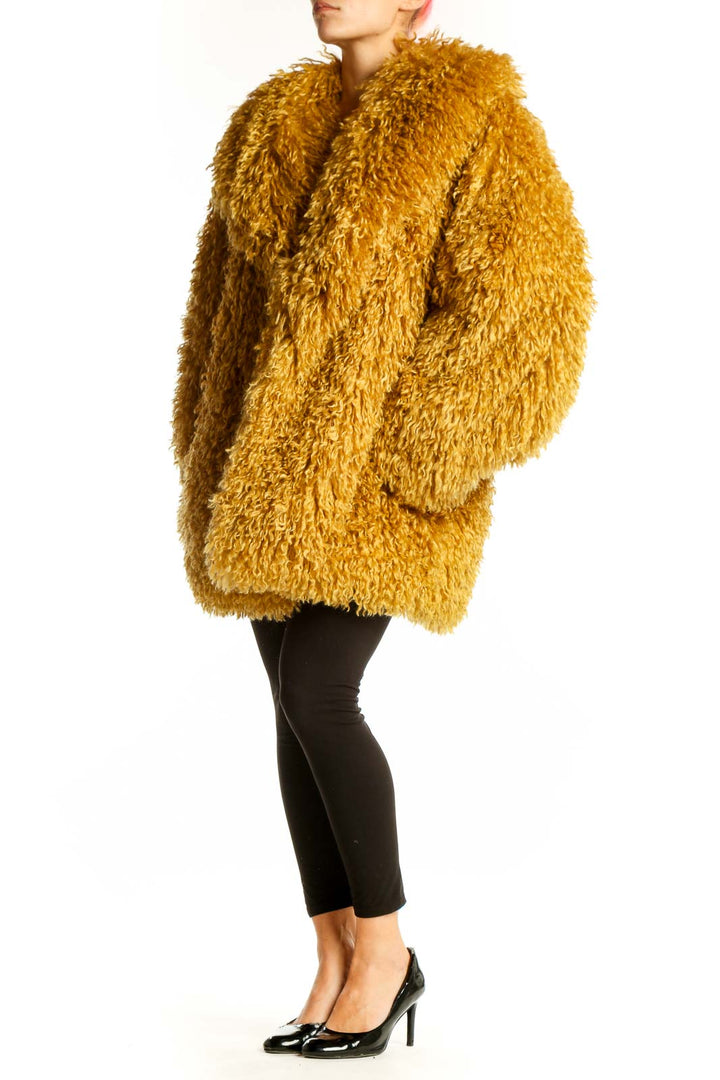 Front view of golden shaggy oversized faux fur jacket from Free People