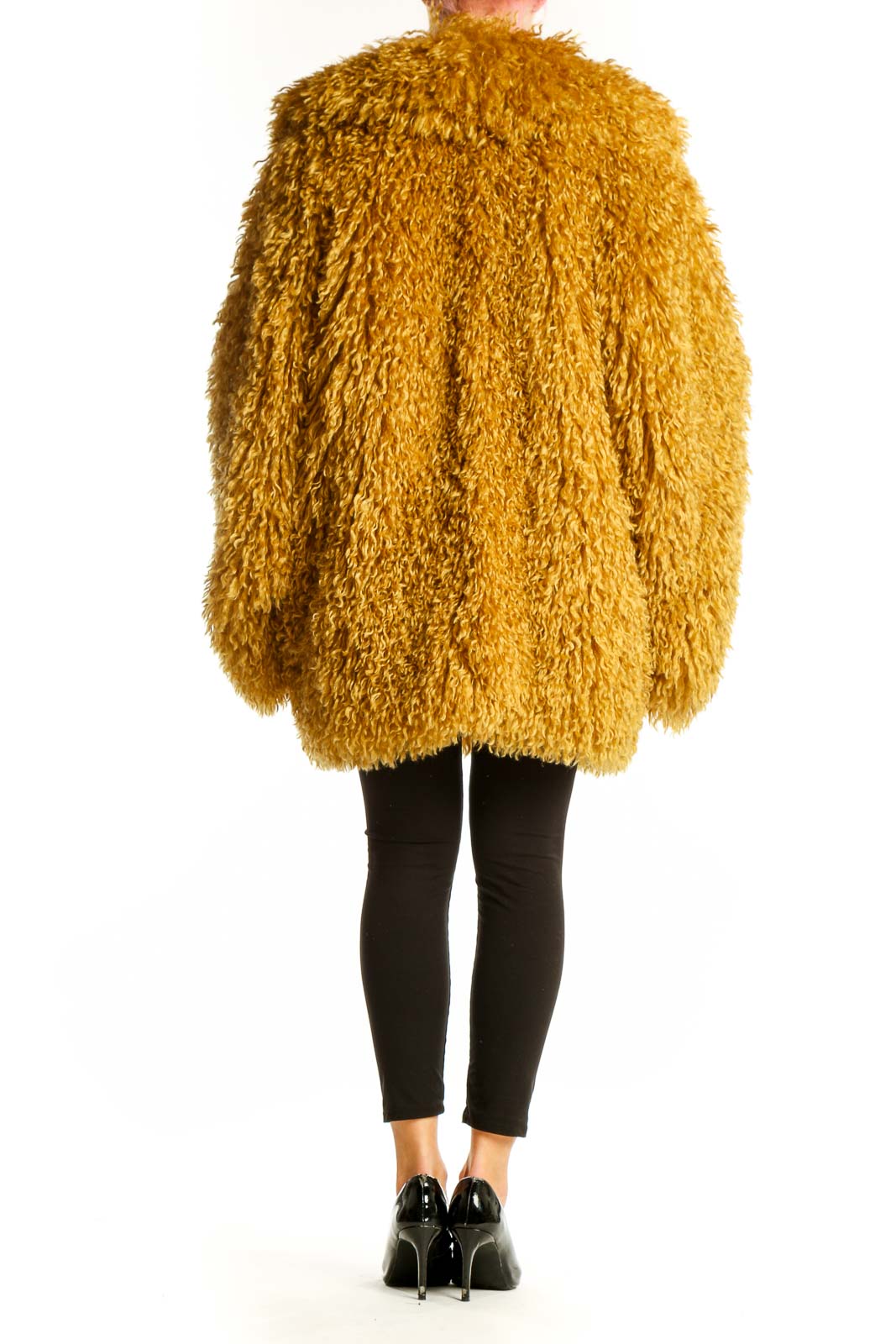 Back view of golden shaggy oversized faux fur jacket from Free People