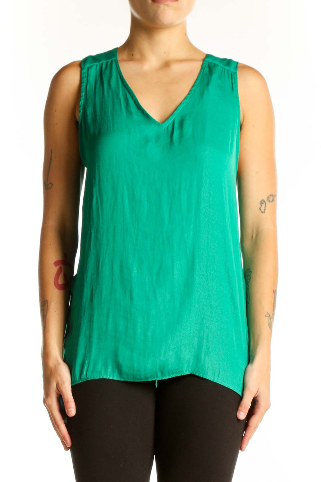 Front view of emerald green sleeveless V-neck blouse by Cupcakes and Cashmere