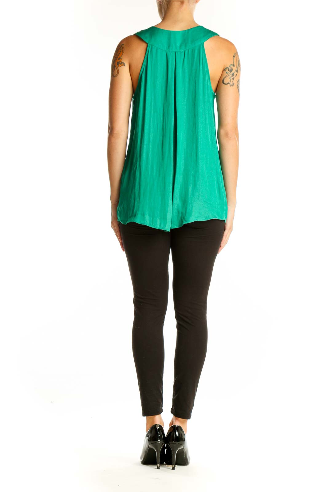 Side view of emerald green sleeveless V-neck blouse by Cupcakes and Cashmere on model