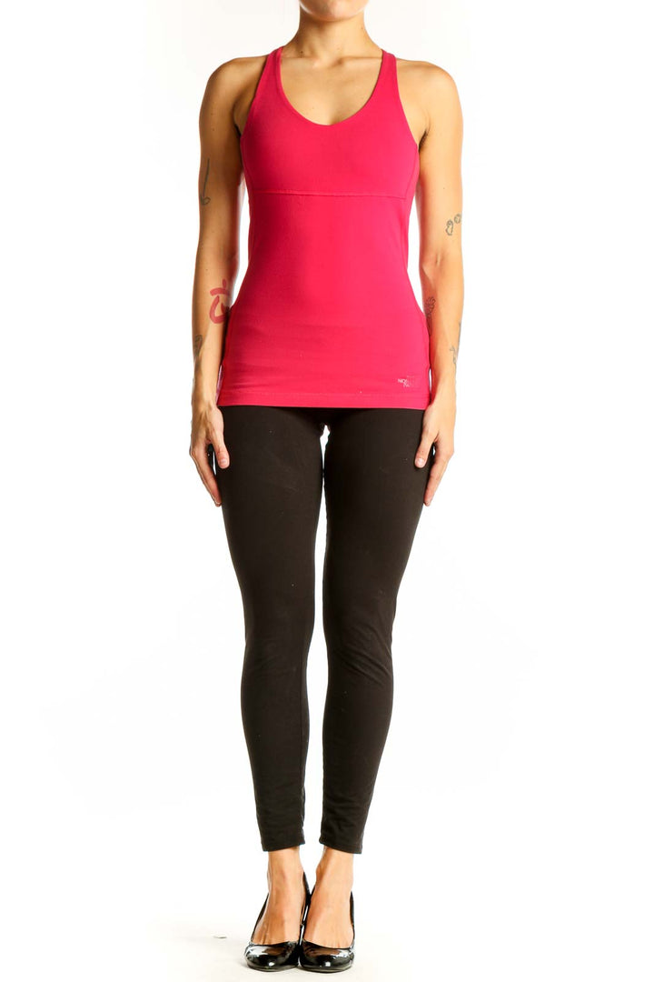 Front view of pink racerback performance tank top from The North Face