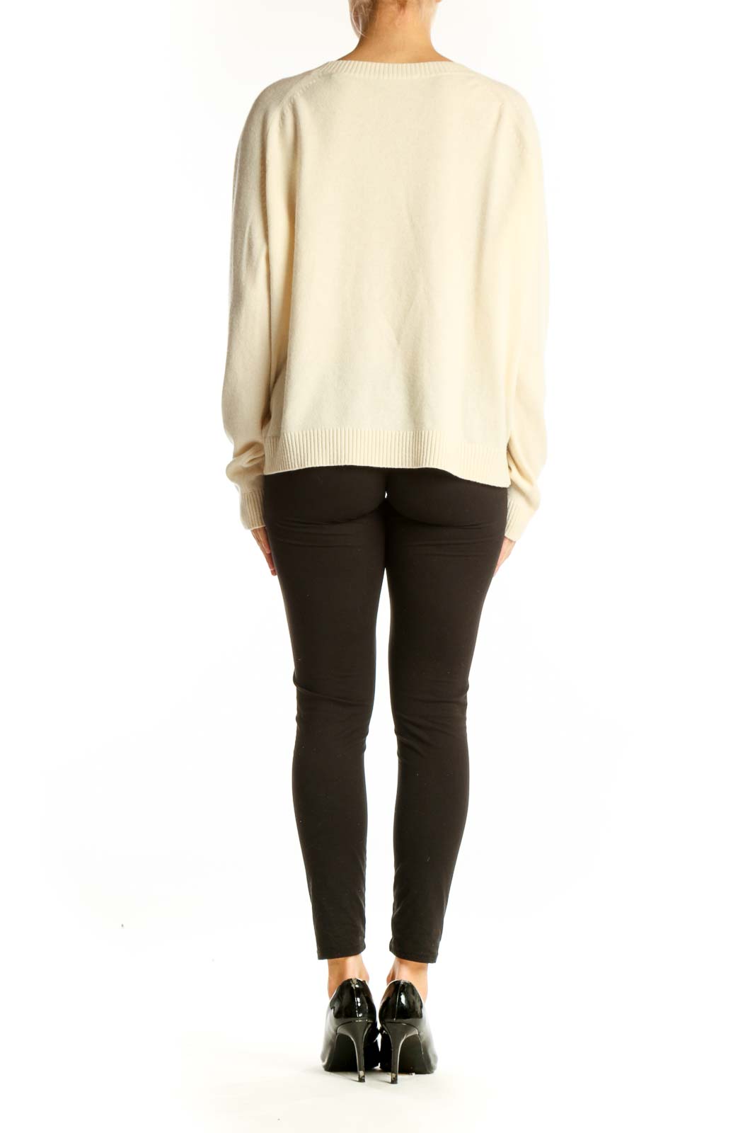 Back view of cream Vince cashmere oversized sweater on model with black pants