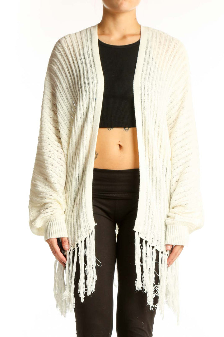 Front view of Fantastic Fawn cream ribbed cardigan with fringe detail