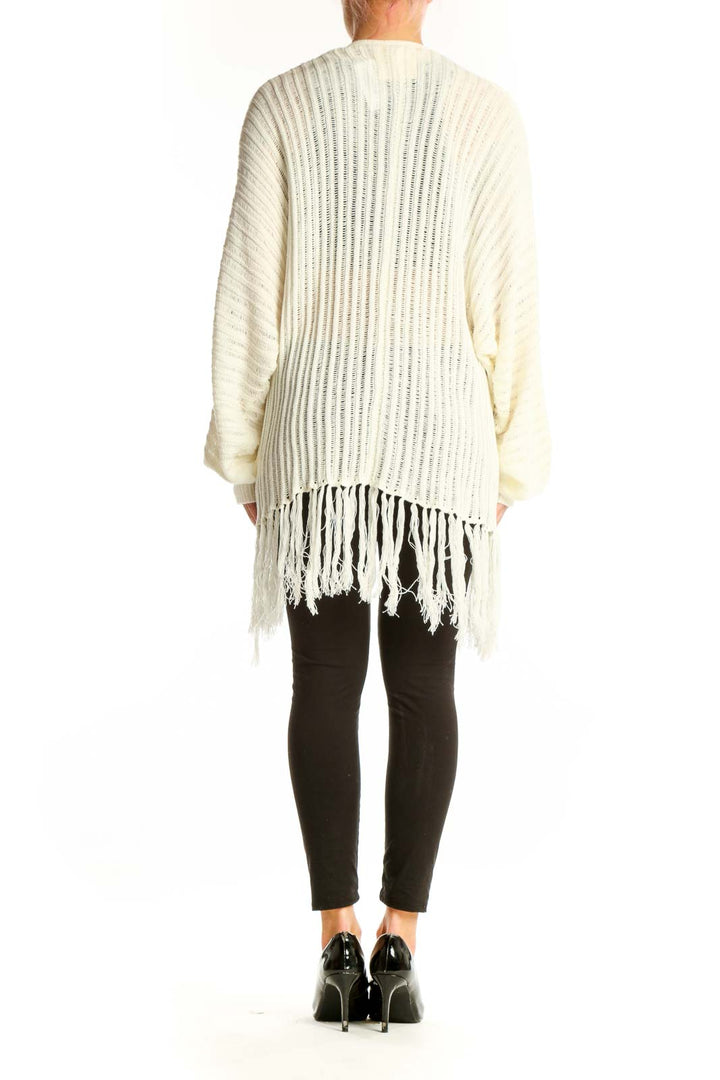 Side view of model wearing Fantastic Fawn cream ribbed cardigan