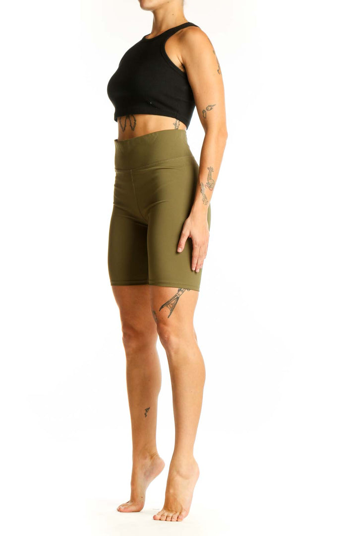 Front view of olive Madewell high-waisted biker shorts