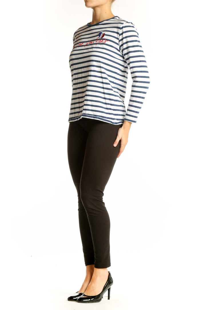 Front view of Etre cecile navy striped long sleeve top with French embroidery