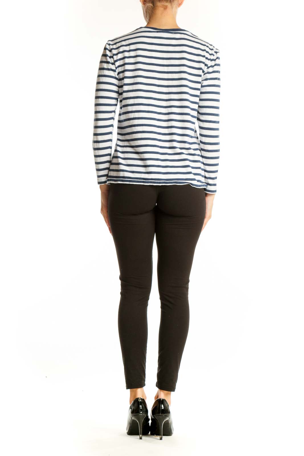 Side view of woman wearing Etre cecile navy striped long sleeve top with black pants