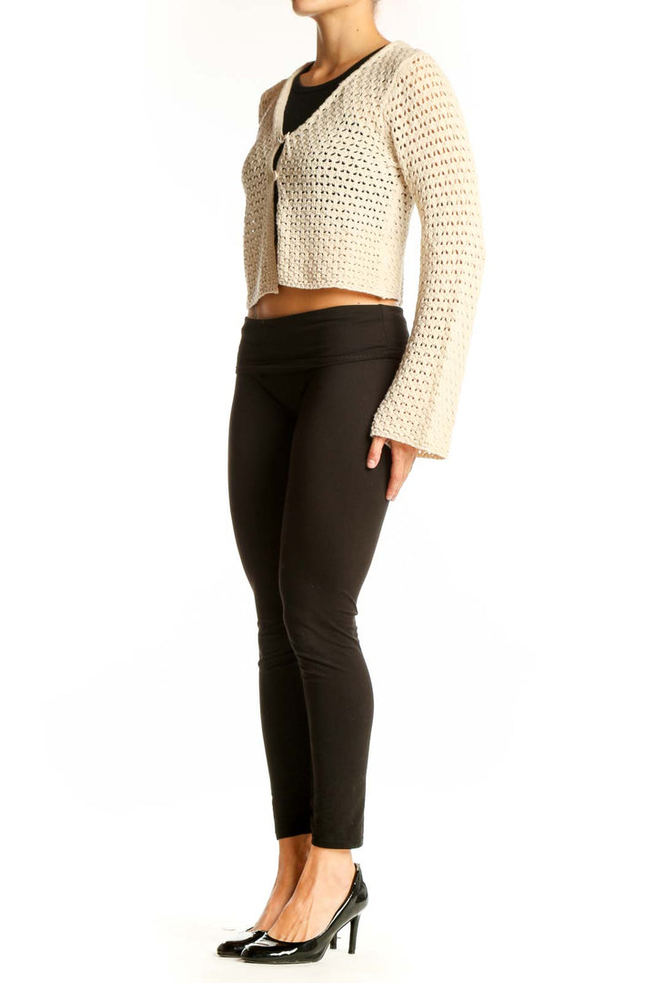 Front view of LOVE ELLIE cream cropped crochet cardigan with single-button closure