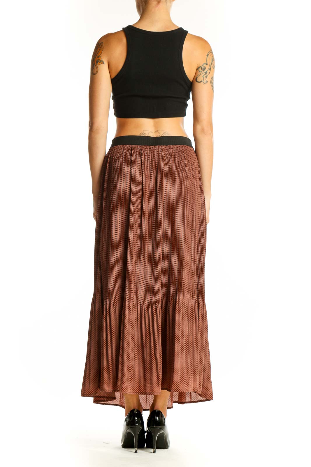 Side view of model wearing Adrianna Papell brown pleated maxi skirt with black crop top