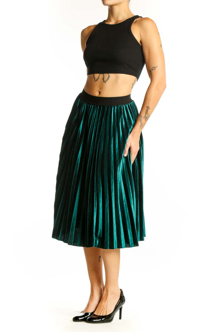 Front view of emerald green pleated velvet midi skirt