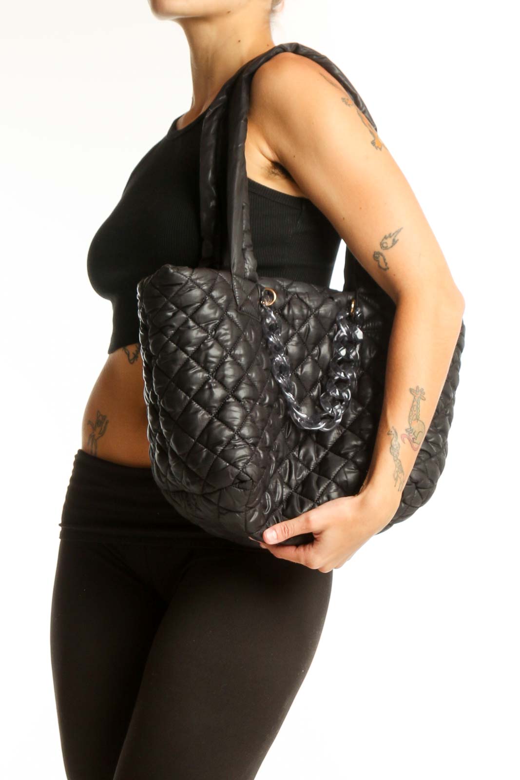 Front view of Jill & Ally black quilted tote bag with long straps