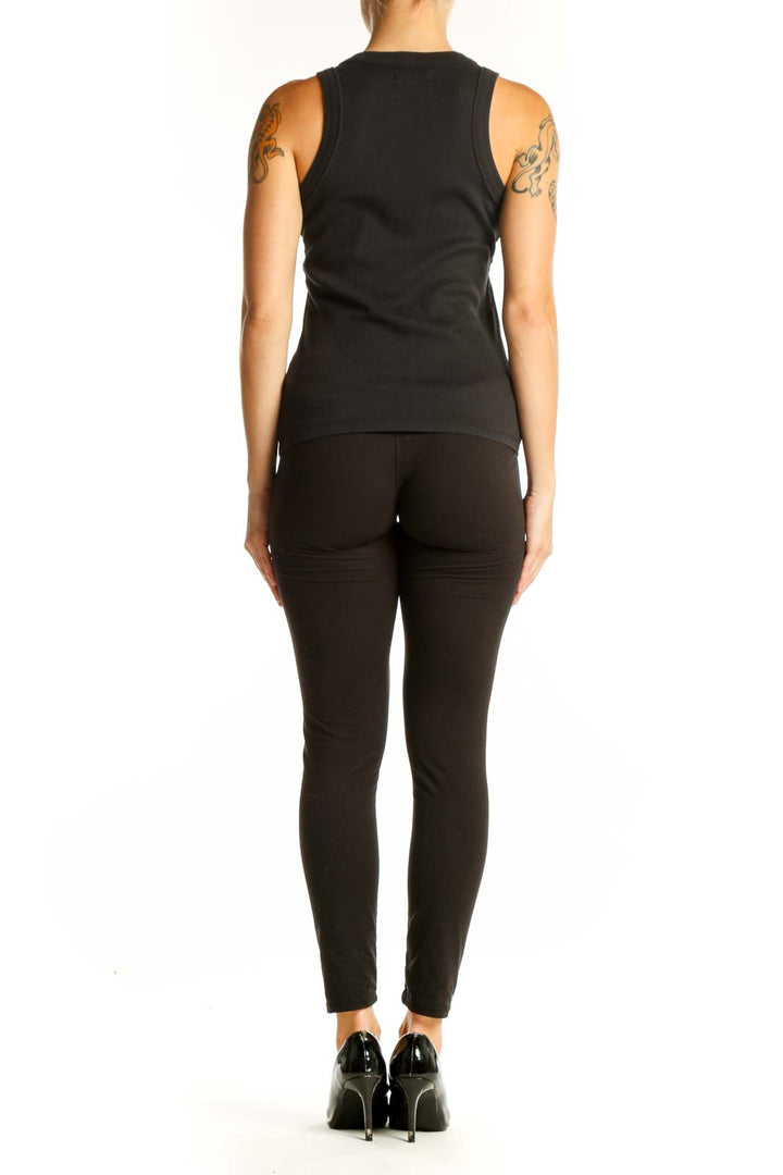 Side view of black Madewell tank top with fitted silhouette