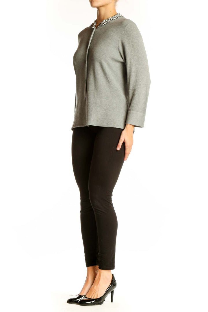 Front view of Ann Taylor gray cardigan with crystal-embellished collar
