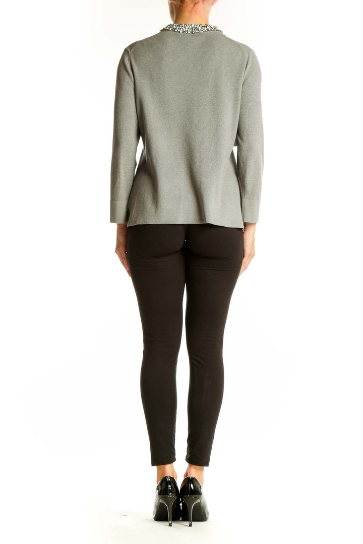 Side view of Ann Taylor gray cardigan showing fitted silhouette