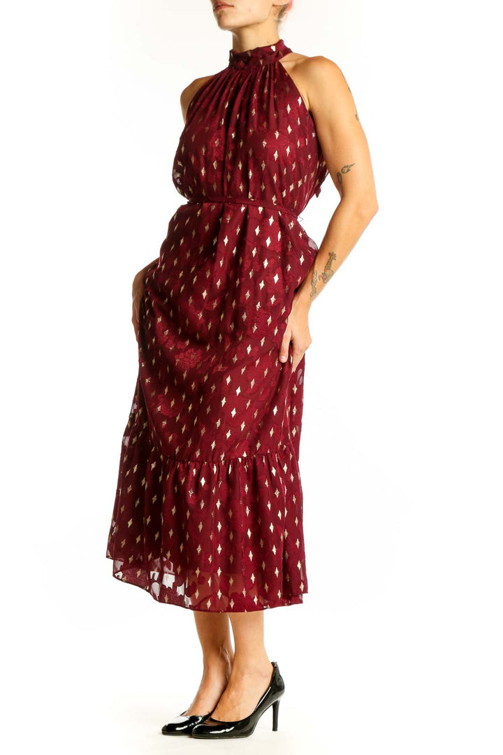 Front view of burgundy halter midi dress with gold diamond pattern