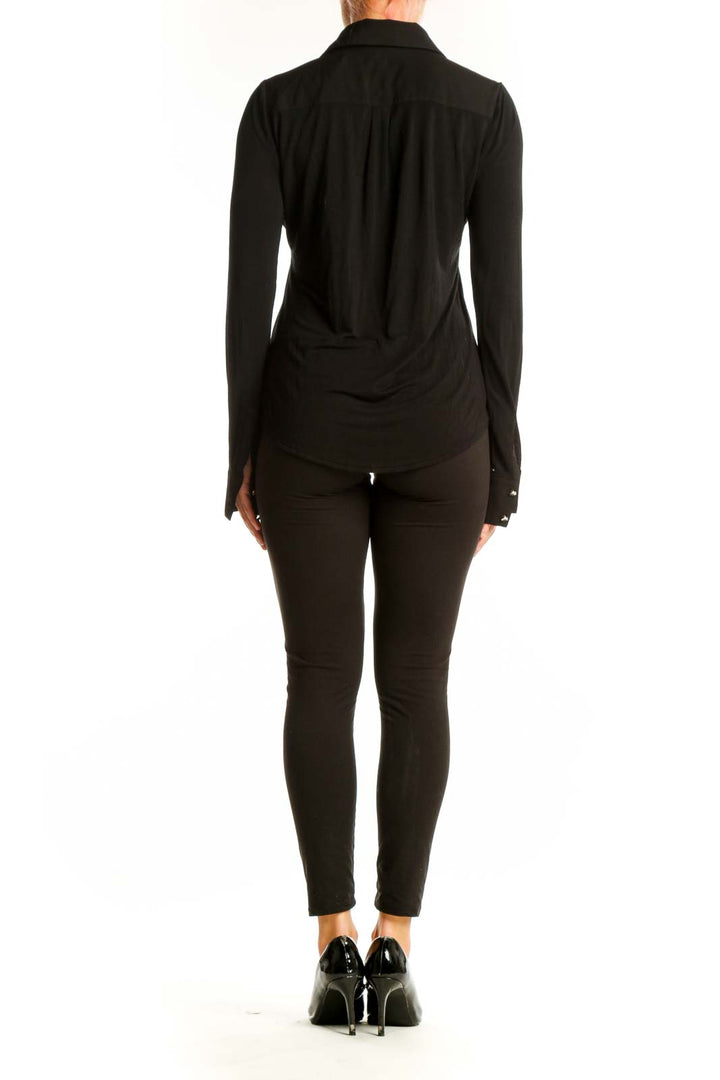 Side view of Black Button-Up Shirt from White House Black Market on model