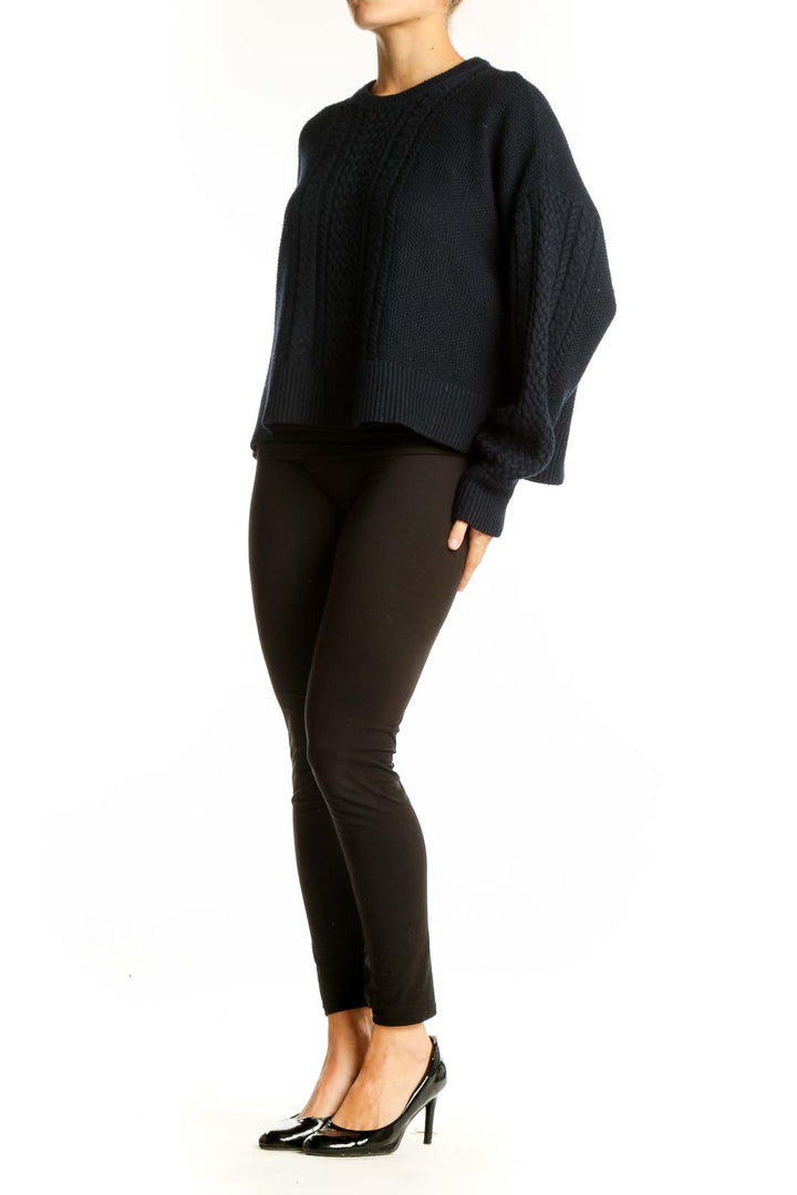 Front view of ATM black cable knit cropped sweater with balloon sleeves