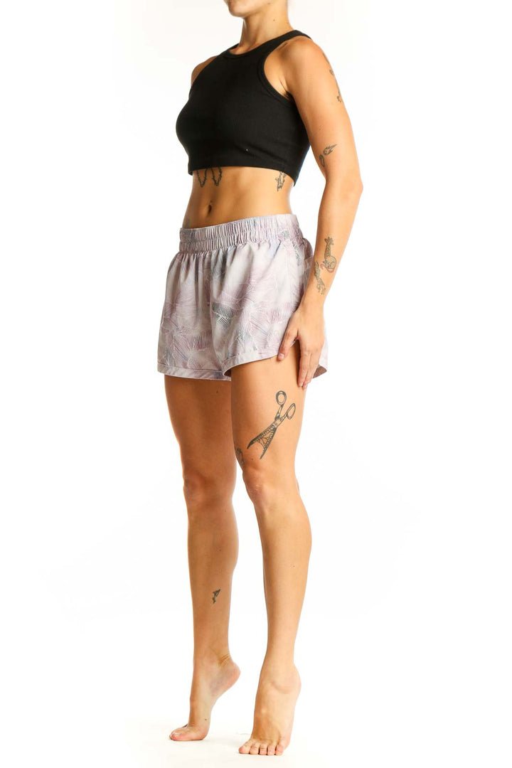 Front view of pink floral print GapFit athletic shorts