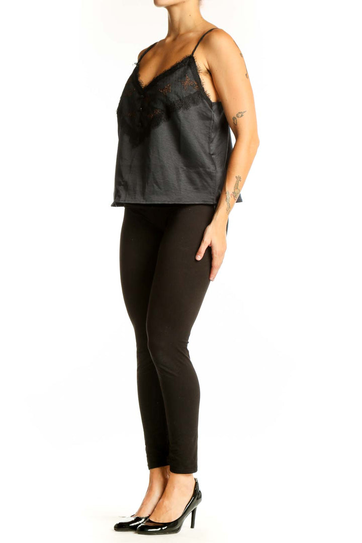 Front view of Jessica Simpson black satin camisole top with lace trim