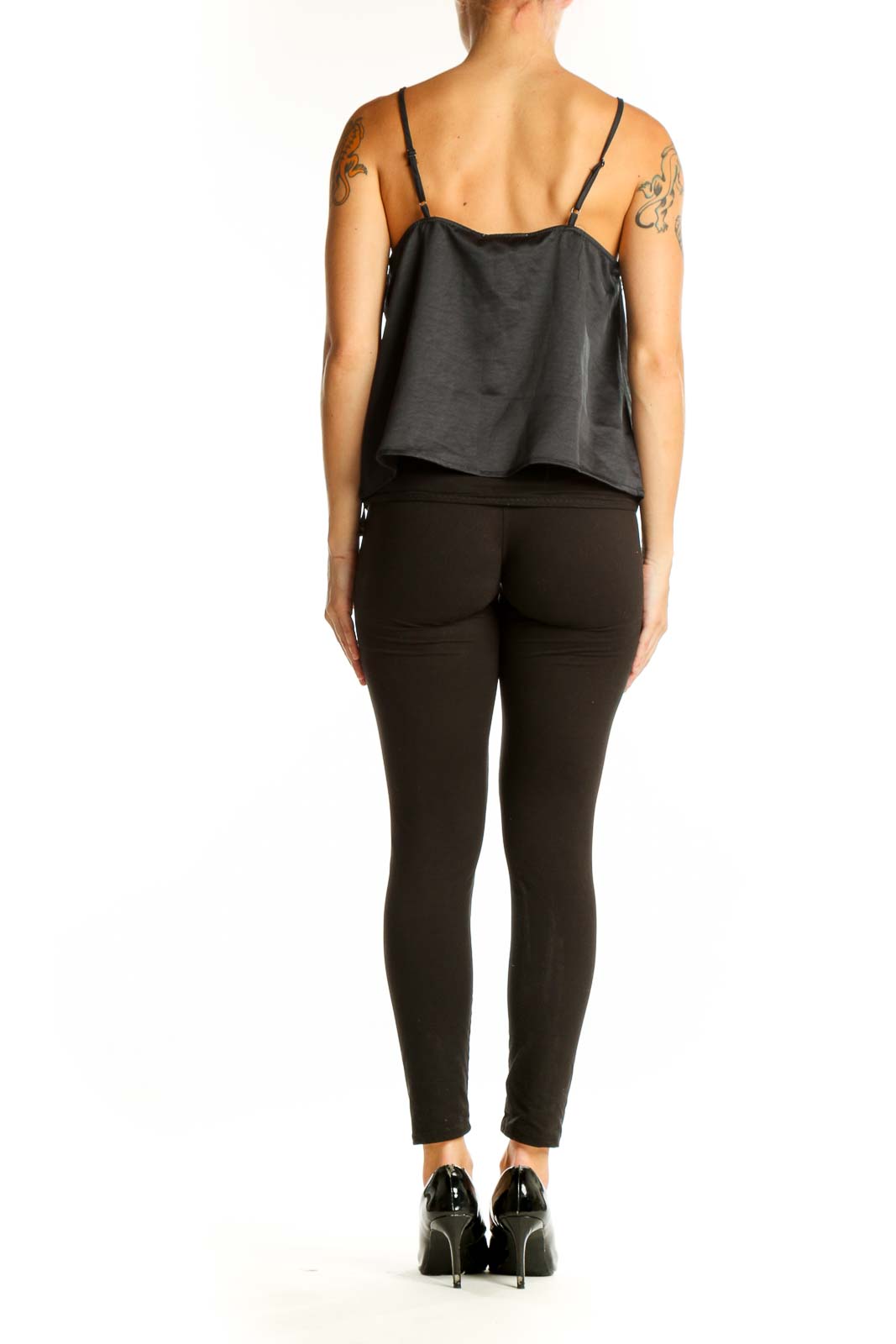 Side view of model wearing Jessica Simpson black satin camisole top