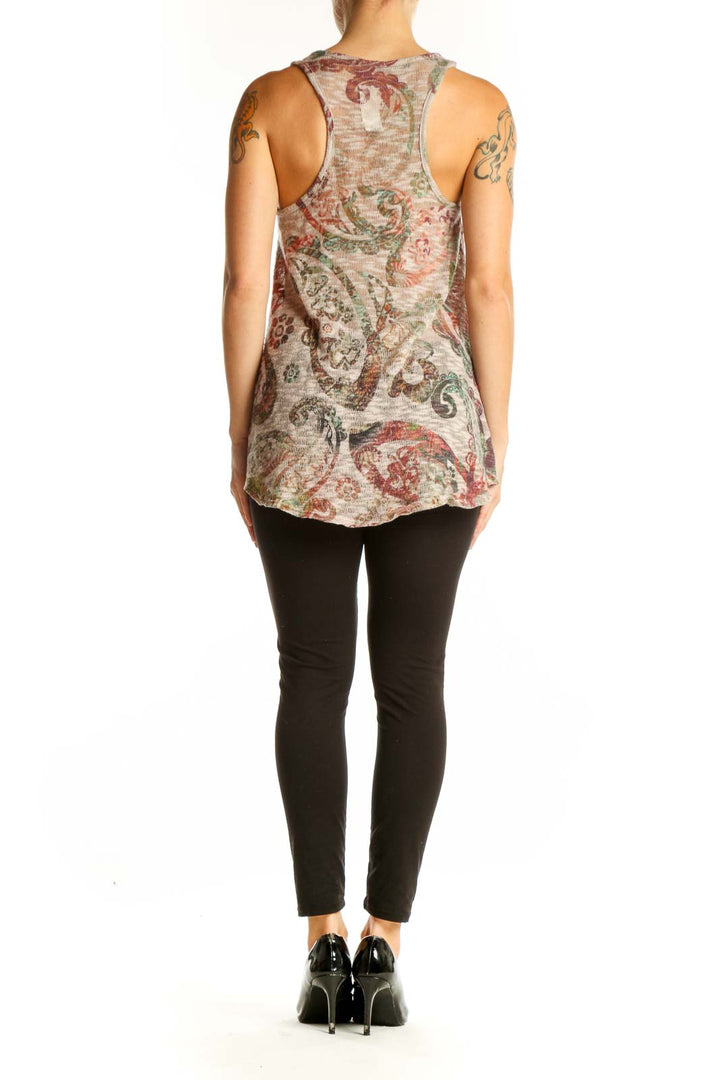 Side view of Enti beige floral paisley tank top on model with black pants