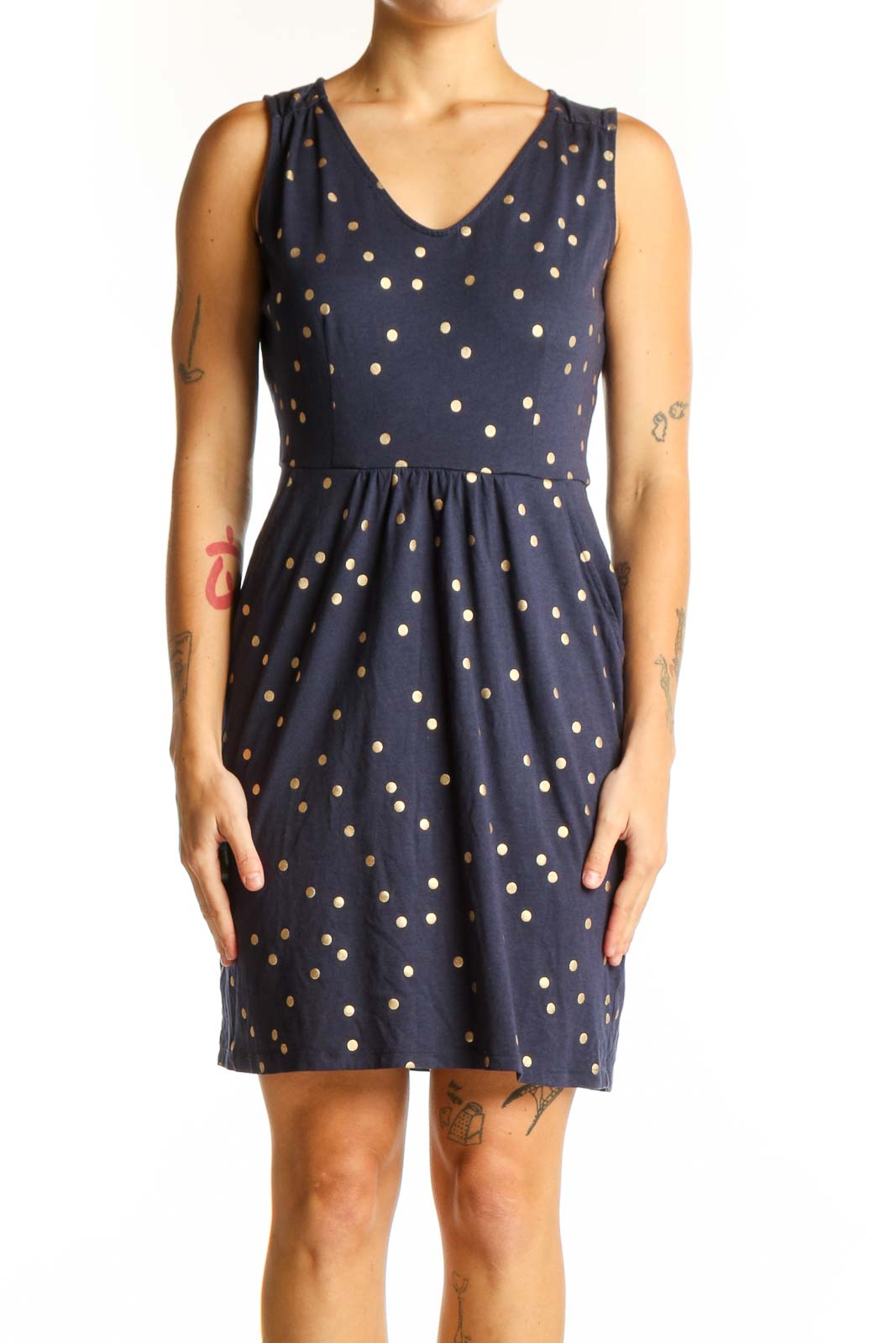 Front view of Boden navy sleeveless dress with gold polka dots