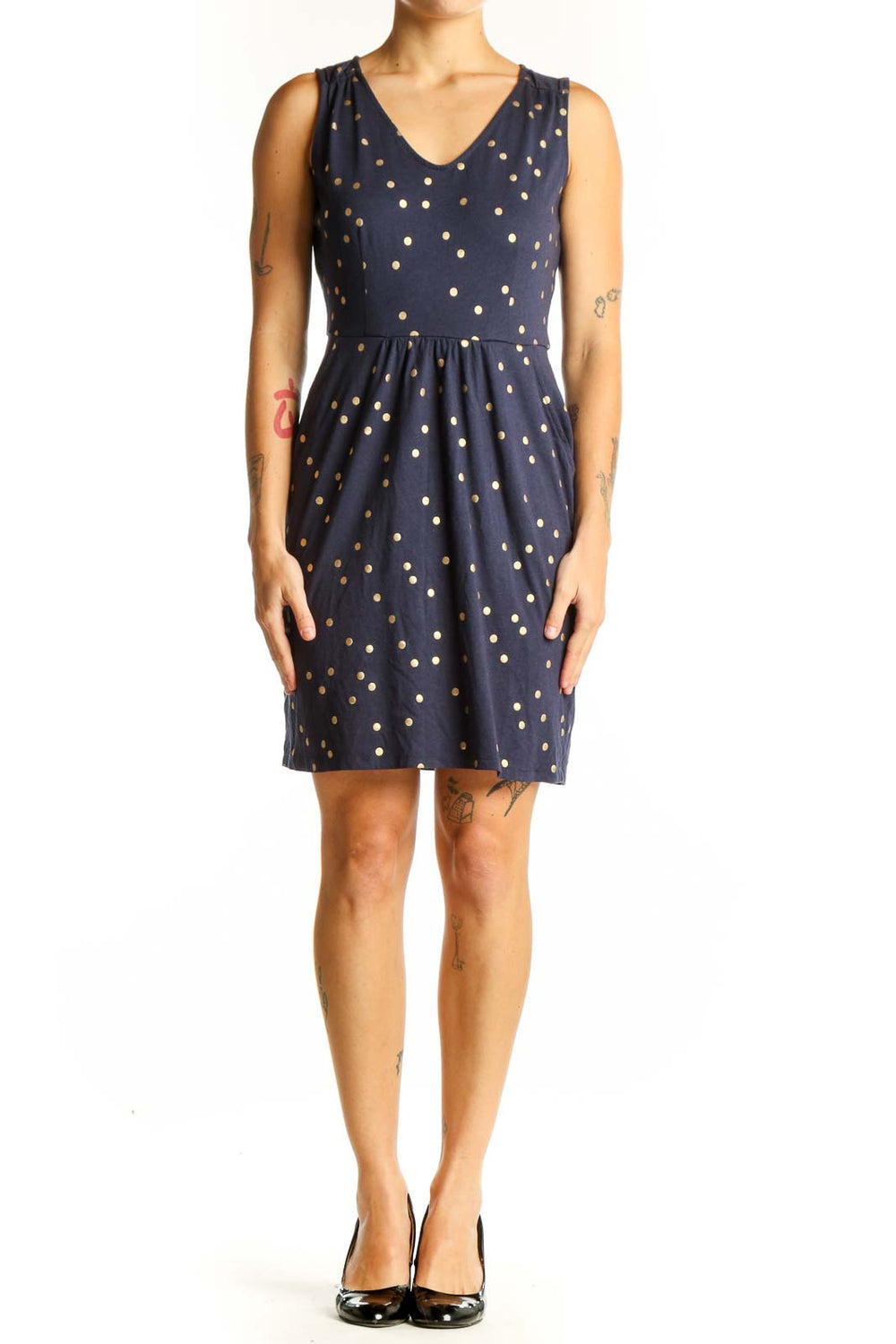 Front view of Boden navy sleeveless dress with gold polka dots