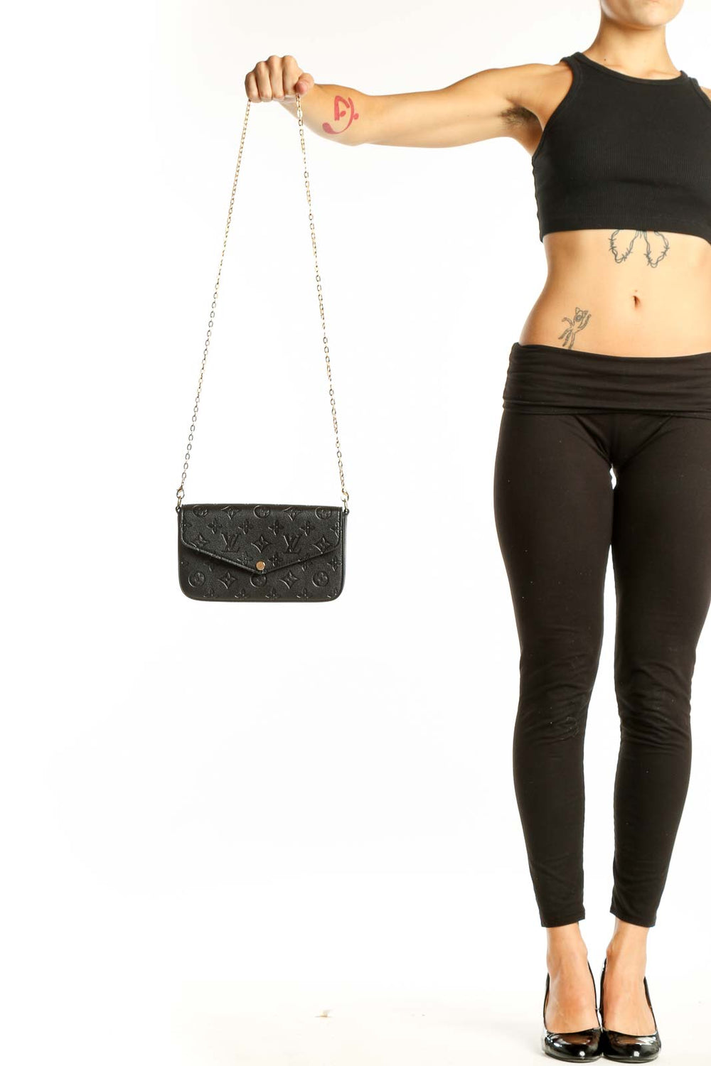 Front view of Louis Vuitton black monogram embossed crossbody bag with gold chain
