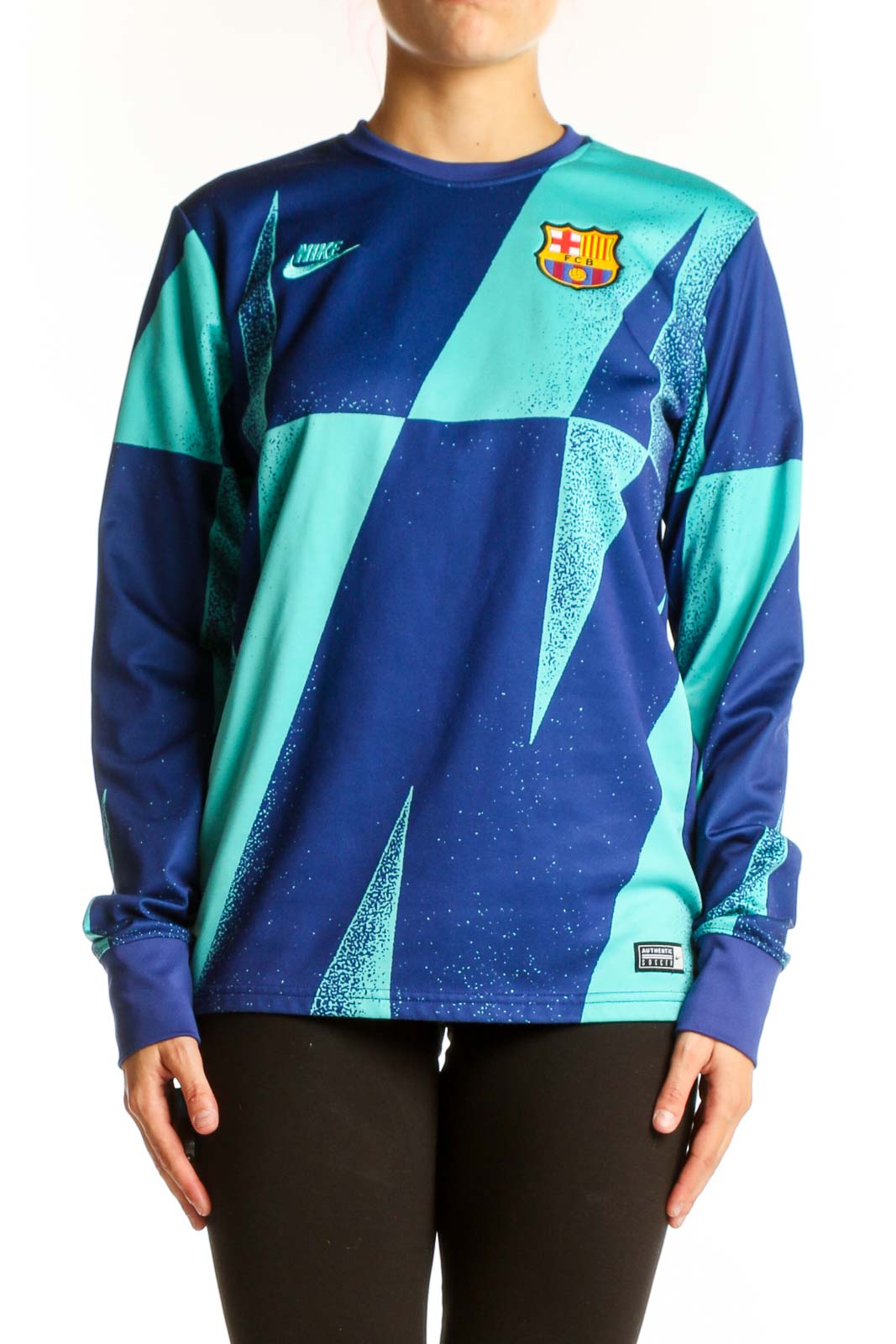 Front view of Nike FC Barcelona blue and teal geometric long sleeve athletic top