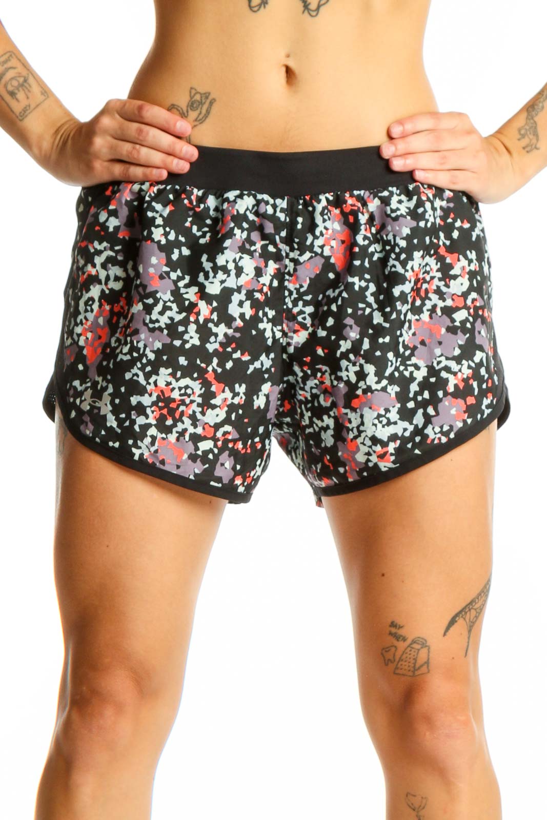 Front view of black floral print Under Armour athletic shorts