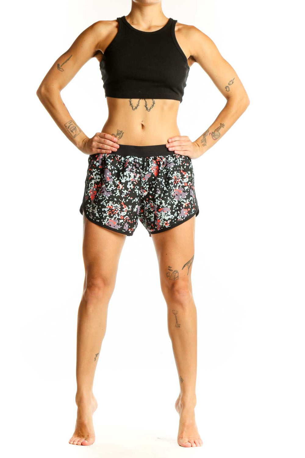 Front view of black floral print Under Armour athletic shorts
