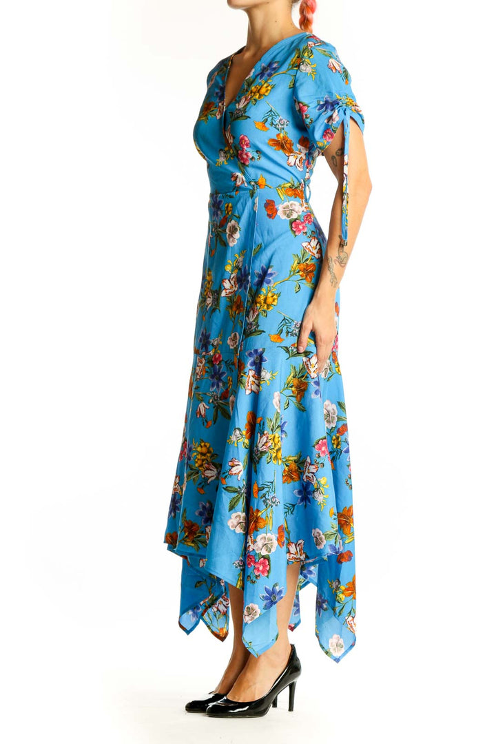 Front view of Calvin Klein blue floral wrap midi dress with handkerchief hem