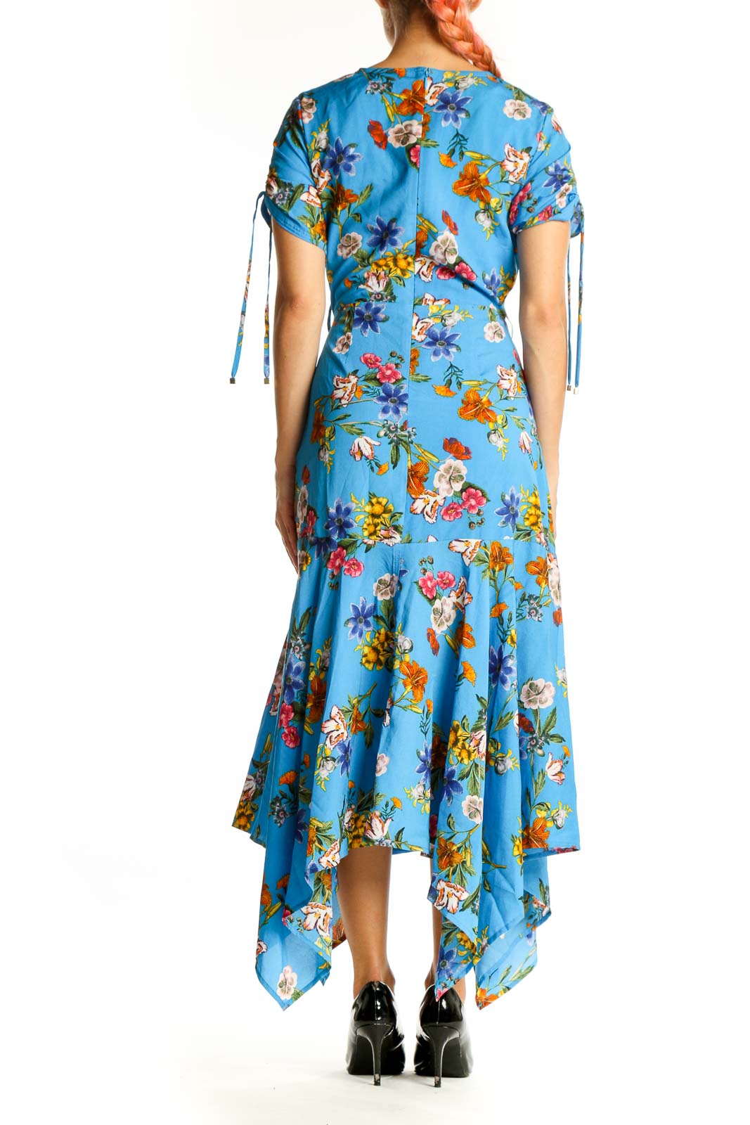 Side view of Calvin Klein blue floral wrap midi dress showing silhouette