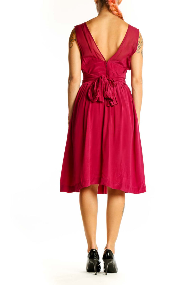 Side view of red silk V-neck pleated cocktail dress by Tracy Reese