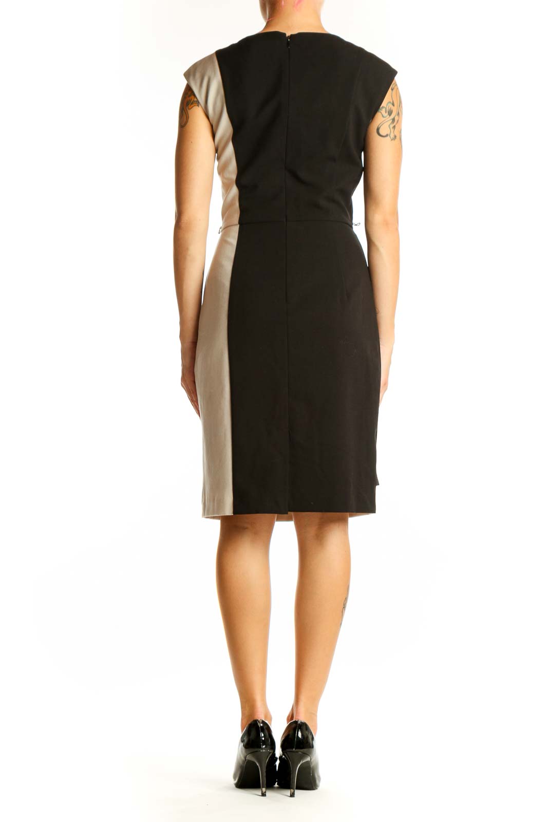 Side view of Calvin Klein black and beige color block sheath dress