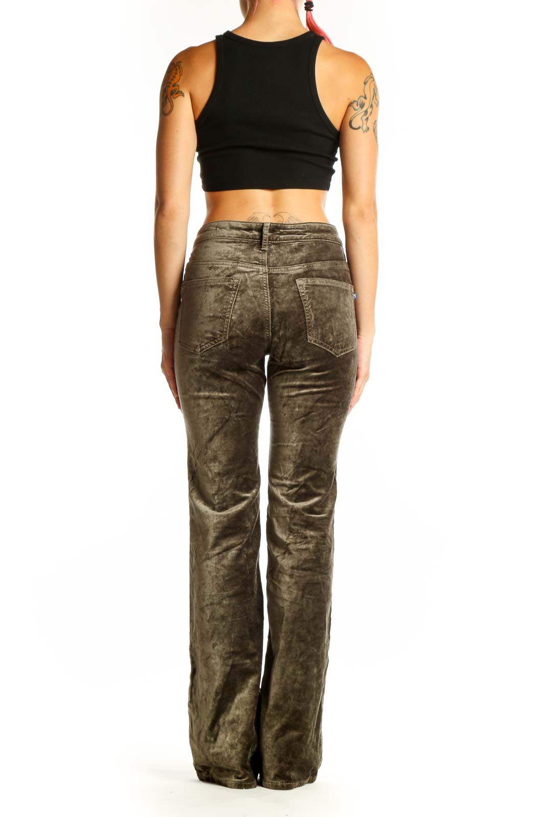 Back view of Pilcro olive velvet flare pants on model