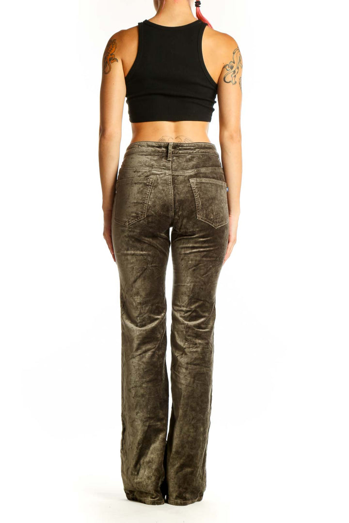 Back view of Pilcro olive velvet flare pants on model