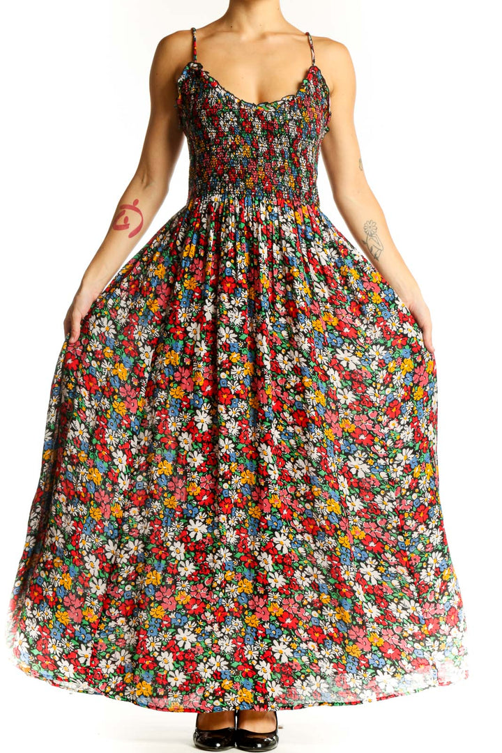 Front view of multicolor floral maxi dress with smocked bodice and spaghetti straps