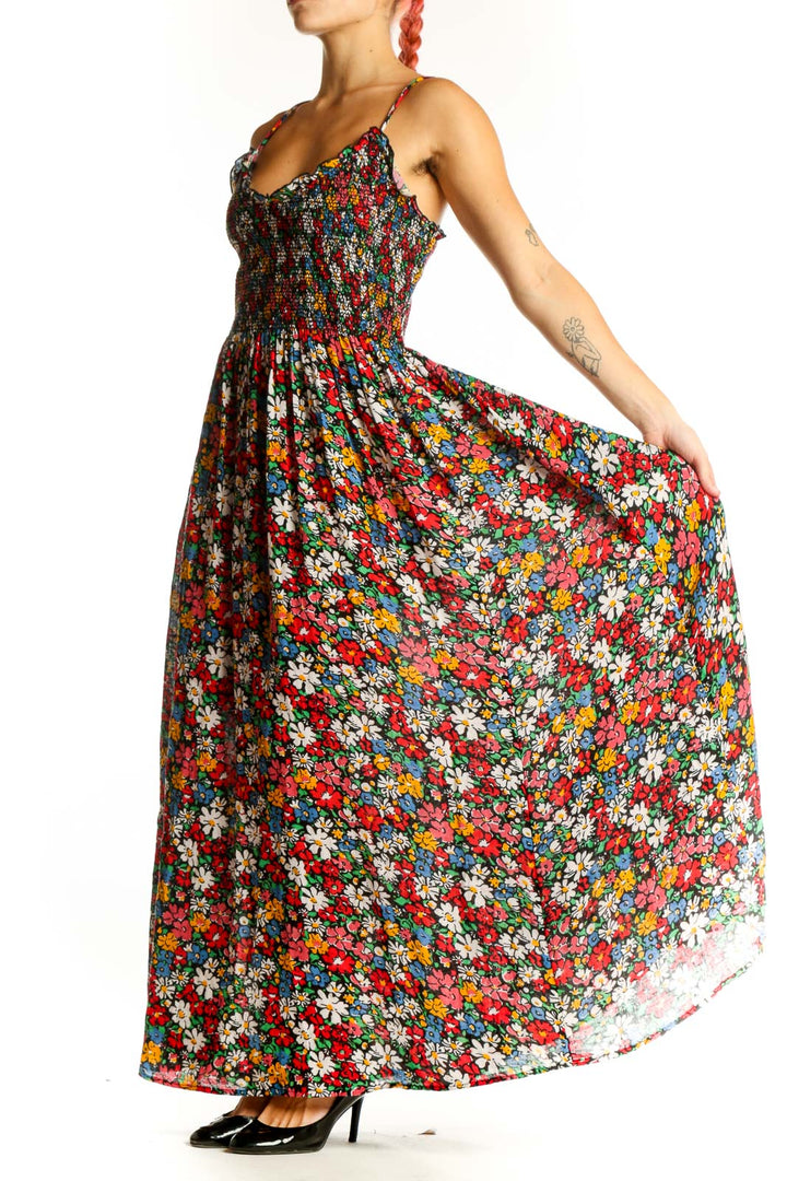 Front view of multicolor floral maxi dress with smocked bodice and spaghetti straps