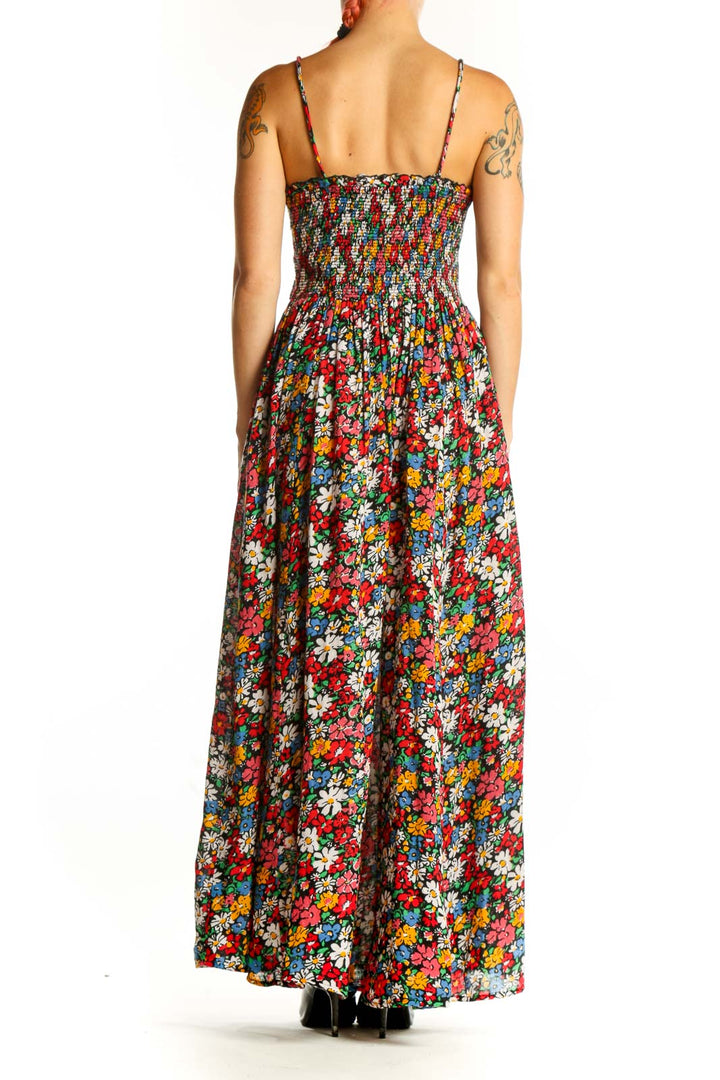 Side view of Free People floral maxi dress showing flowing skirt and vibrant print