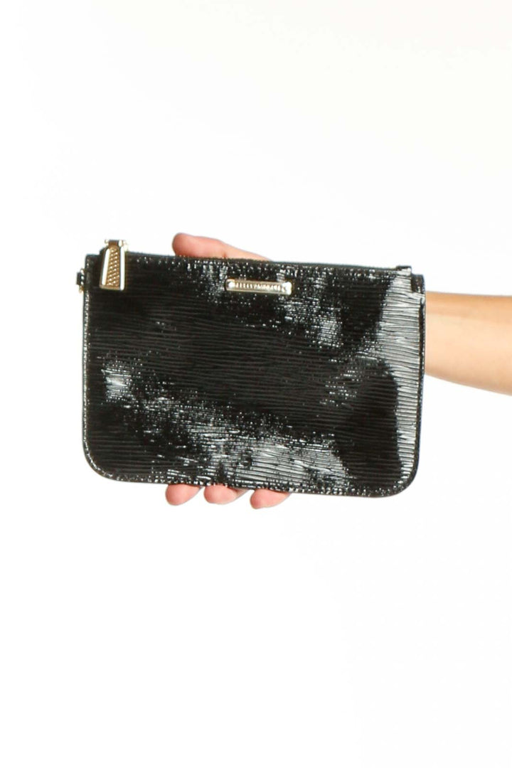 Front view of Rebecca Minkoff black sequined clutch held in hand
