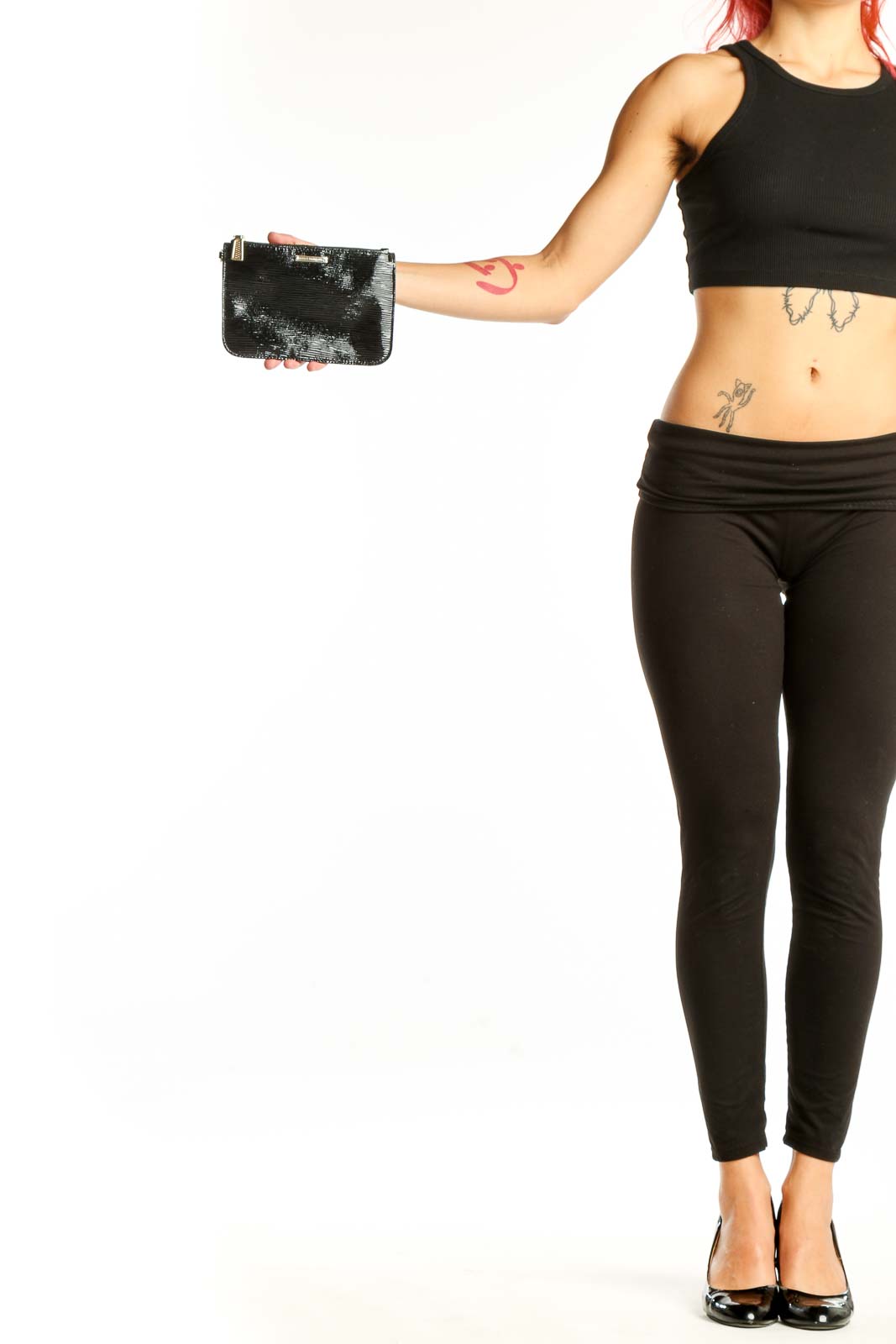 Front view of Rebecca Minkoff black sequined clutch held in hand