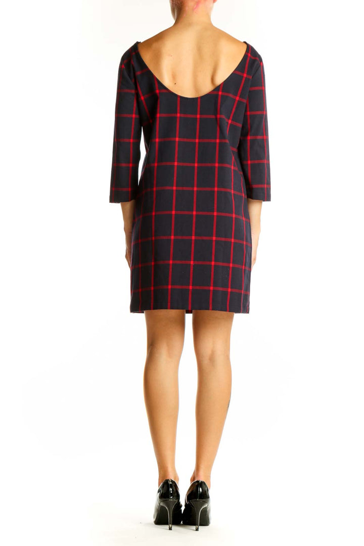 Side view of Mango black and red plaid shift dress showing 3/4 length sleeves