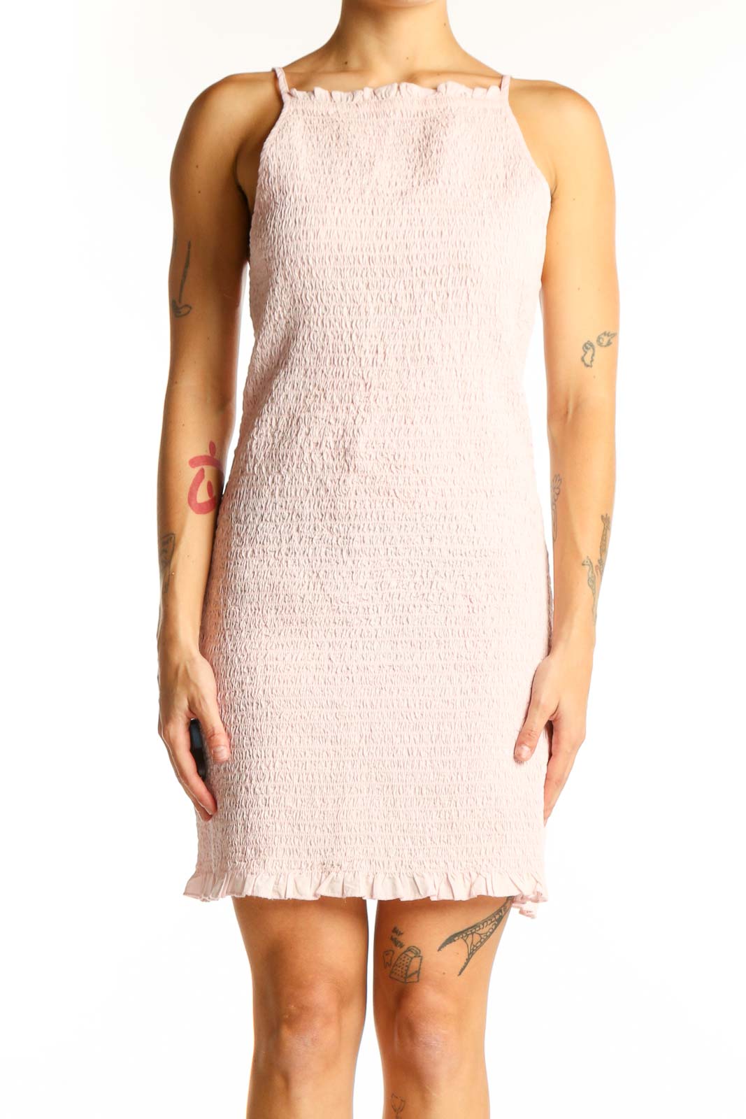 Front view of blush pink smocked mini dress with spaghetti straps
